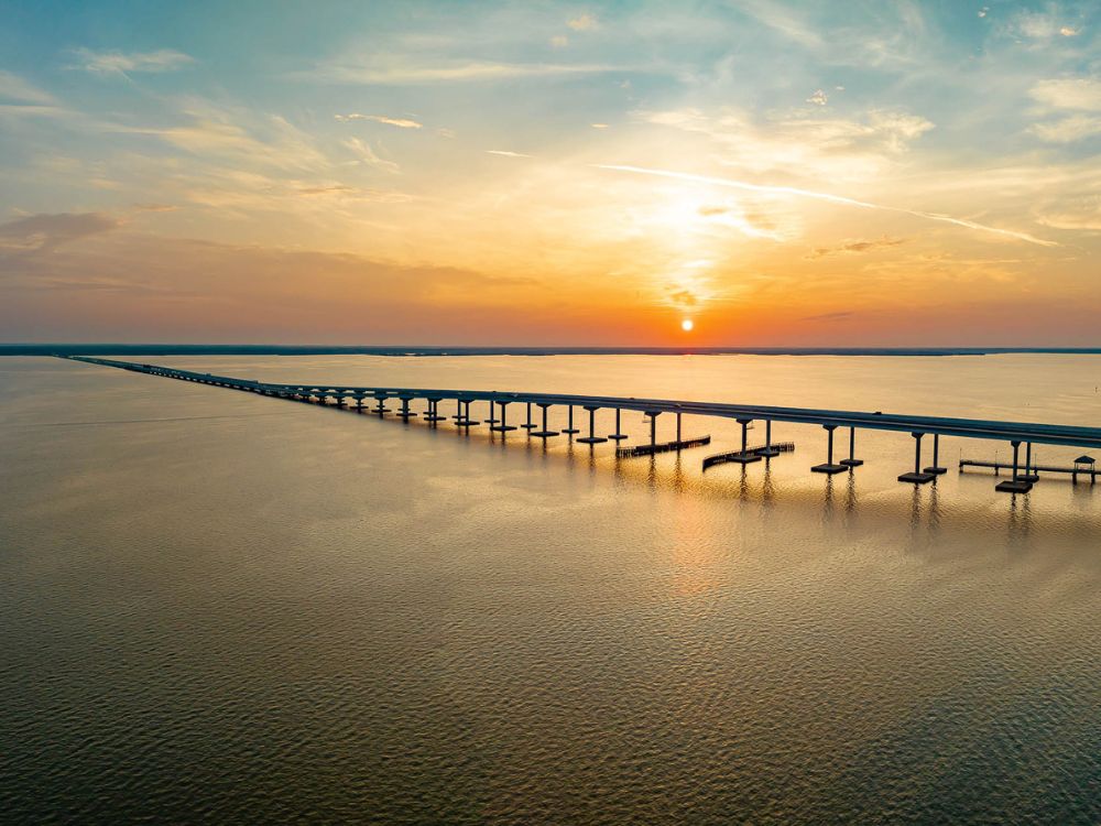 Image of a man casting a net in the Choctawhatchee Bay