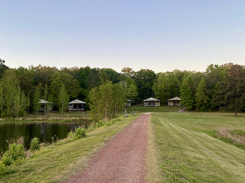 Across the dam are waterfront glamping tents.
