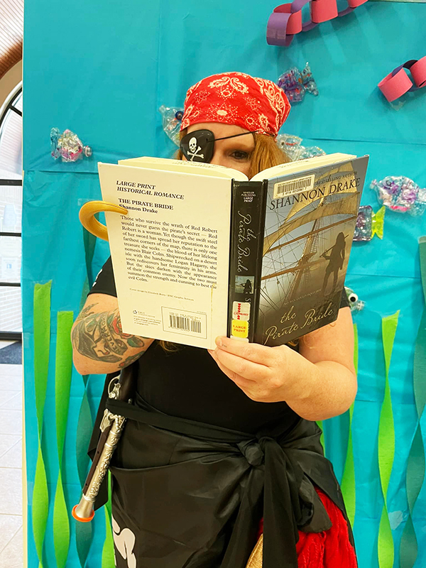 Pirate character reading a book