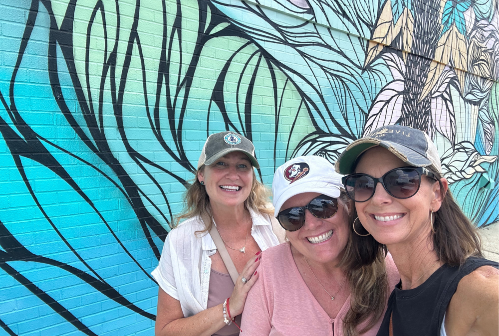 Mural on CCB Bank Wall in Historic Defuniak Springs with lifelong friends taking a selfie. Mural on CCB Bank Wall in Historic Defuniak Springs with lifelong friends taking a selfie.
